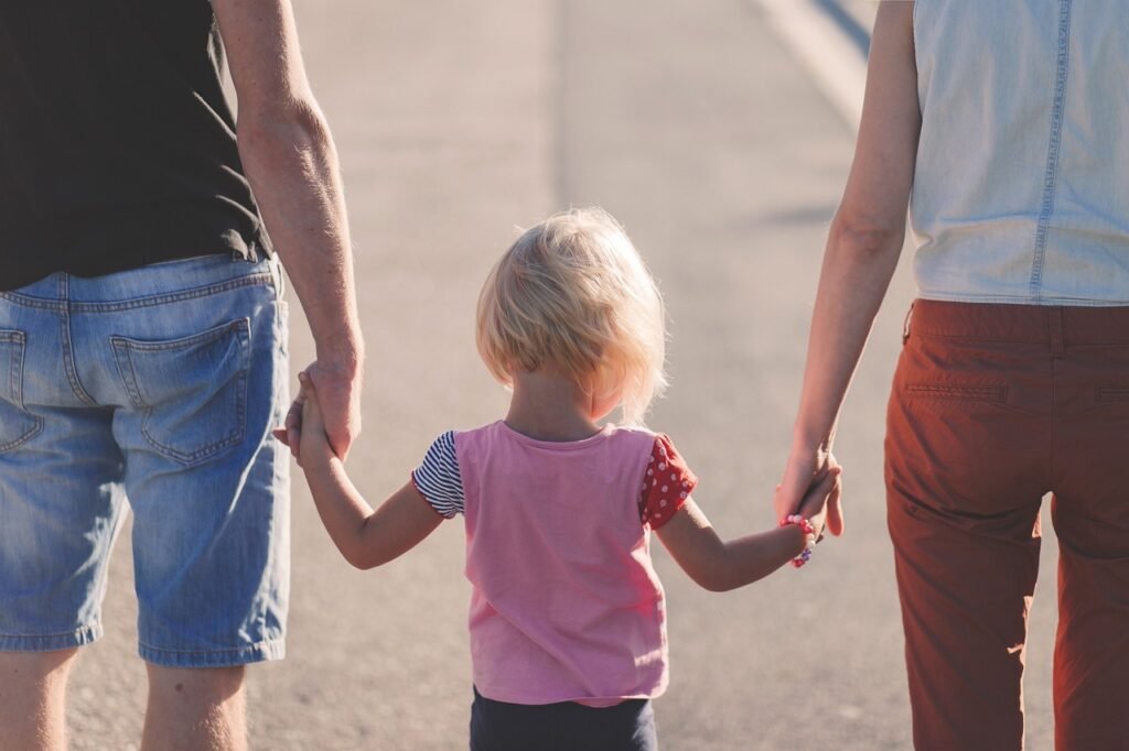Photo by Pexels - NewsOk family, holding hands, parents