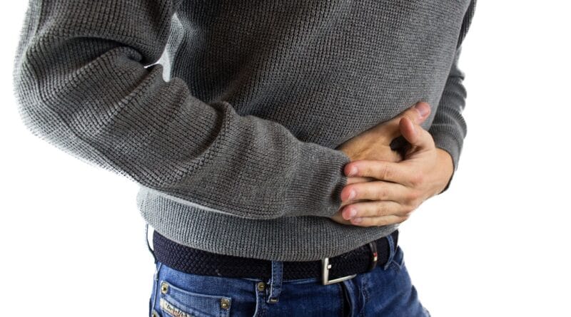 stomach pain, man, jeans